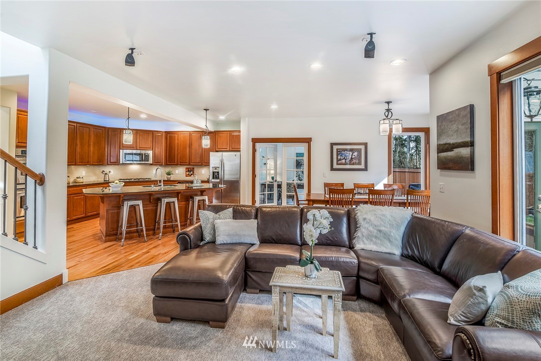 22548 5th Place West Bothell, WA 98021 - Photo 21 of 38 a living room with furniture kitchen view and a wooden floor