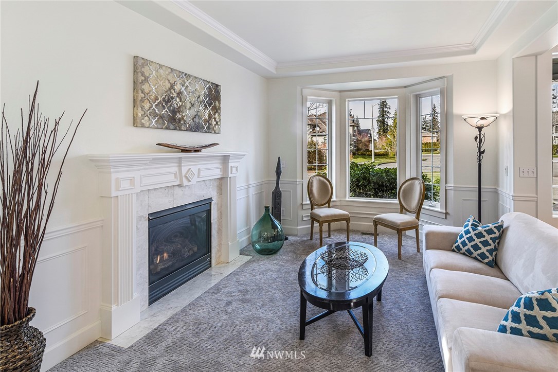 22548 5th Place West Bothell, WA 98021 - Photo 23 of 38 a living room with furniture a window and a fireplace