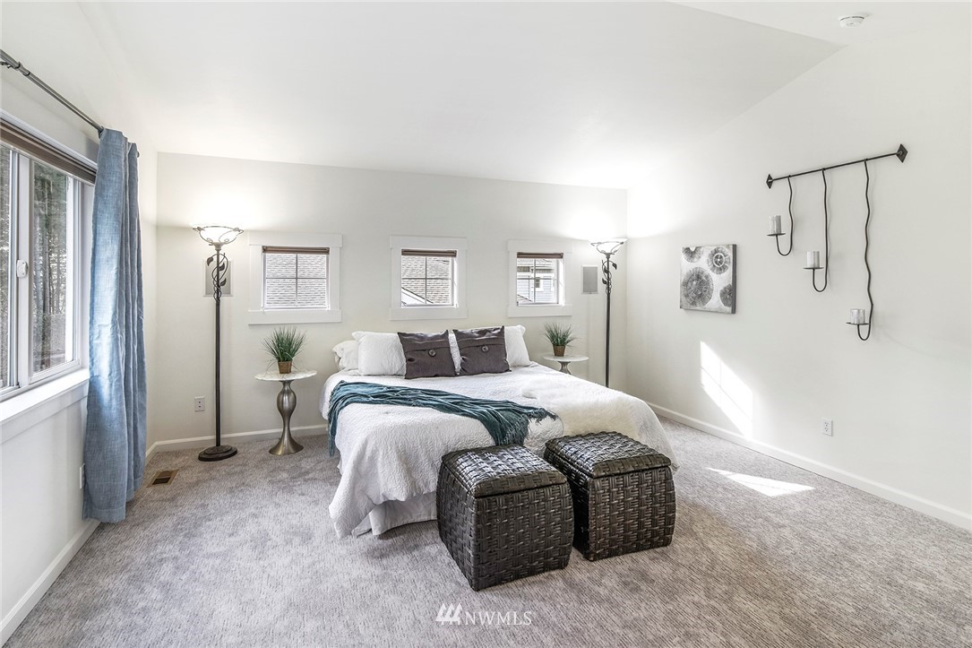 22548 5th Place West Bothell, WA 98021 - Photo 27 of 38 a bedroom with double bed and a window