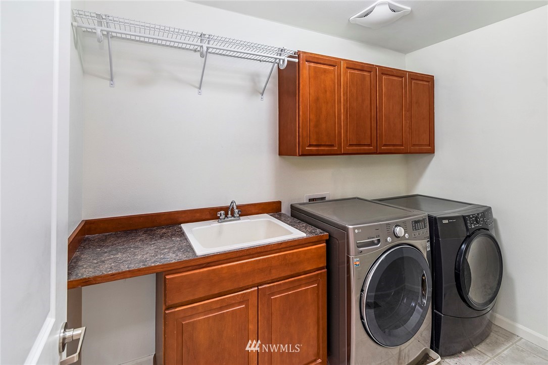 22548 5th Place West Bothell, WA 98021 - Photo 30 of 38 a utility room with dryer and washer