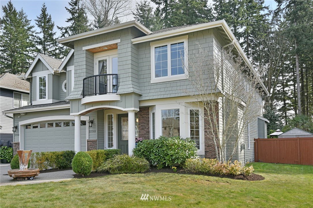 22548 5th Place West Bothell, WA 98021 - Photo 4 of 38 a front view of a house with garden