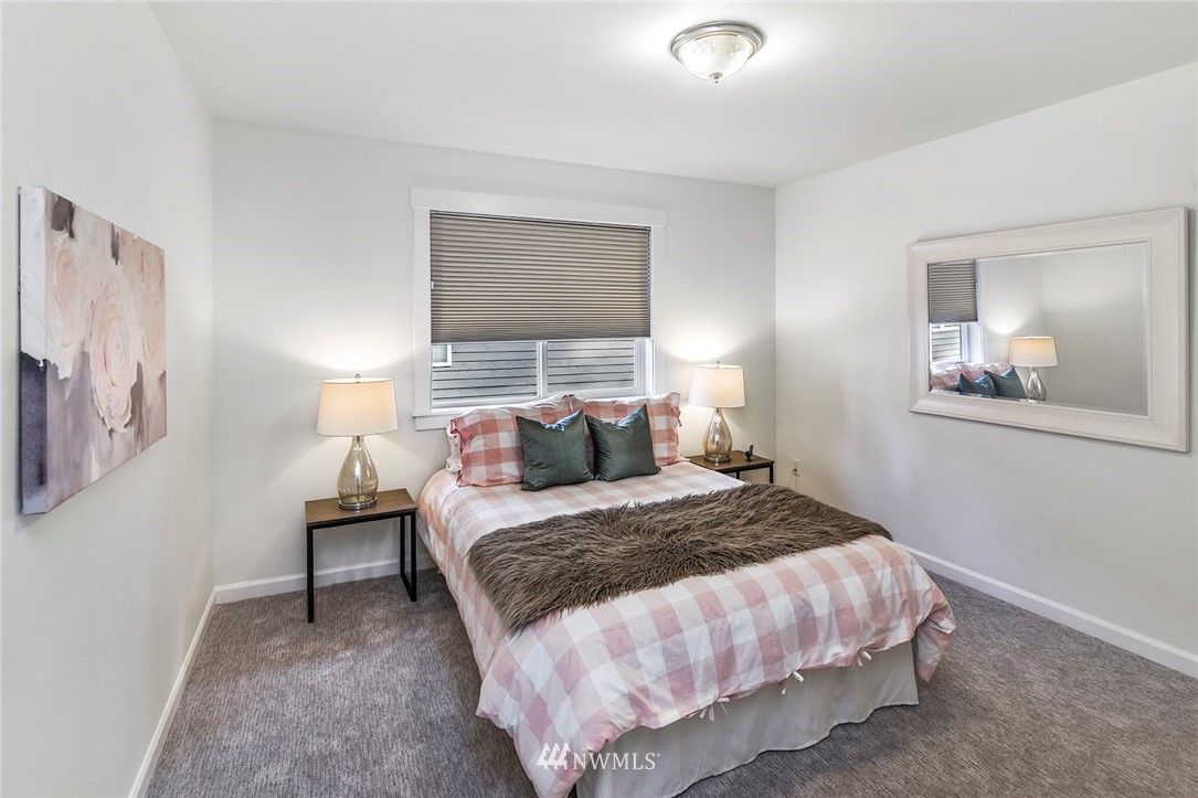 22548 5th Place West Bothell, WA 98021 - Photo 31 of 38 a bedroom with a bed and a window