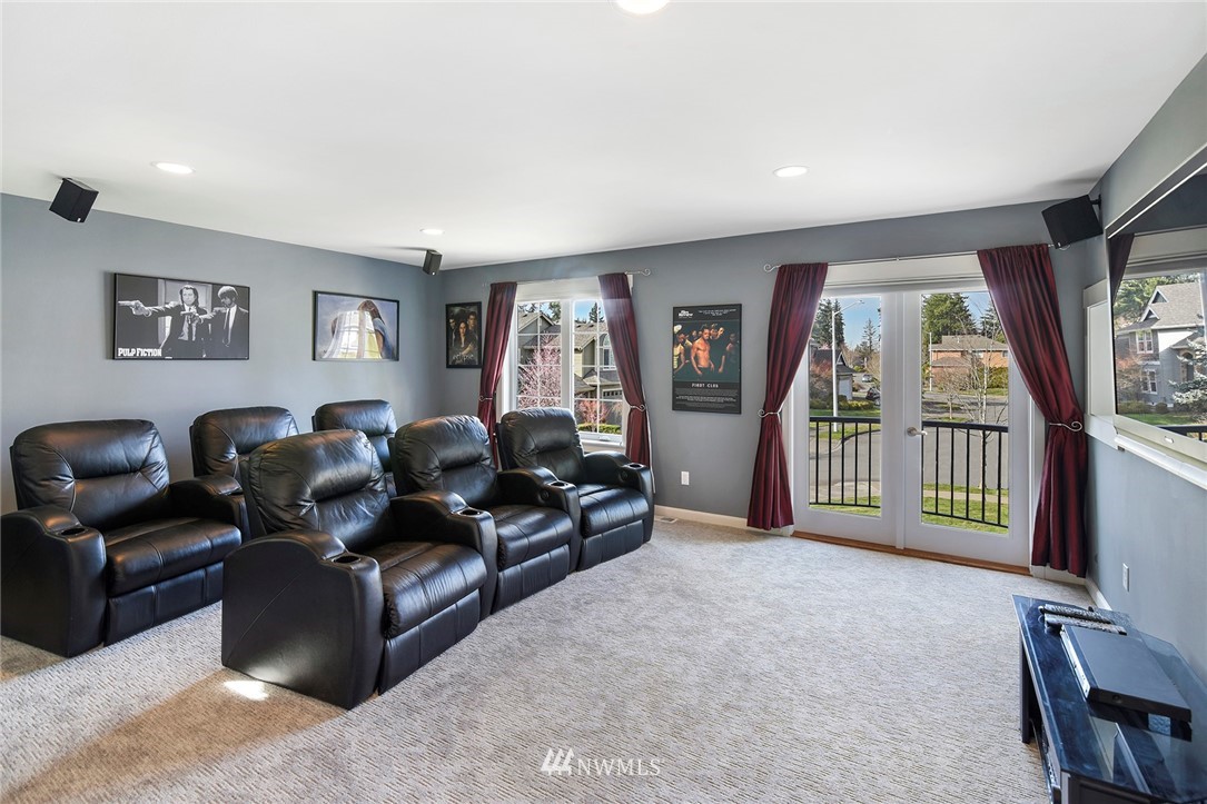 22548 5th Place West Bothell, WA 98021 - Photo 32 of 38 a living room with furniture and a flat screen tv