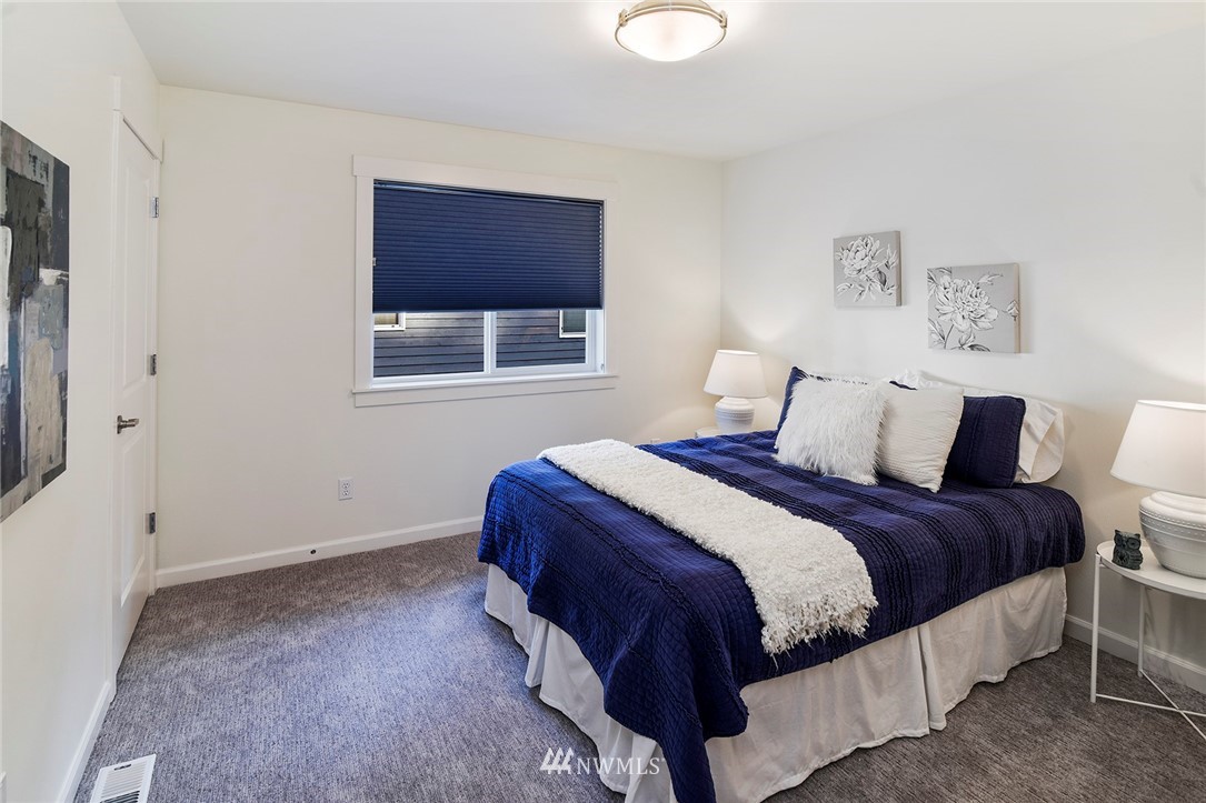 22548 5th Place West Bothell, WA 98021 - Photo 36 of 38 a bedroom with a bed and a window