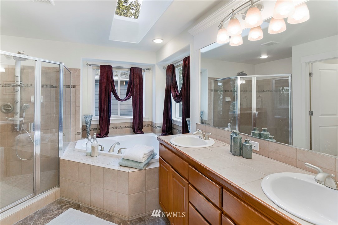 22548 5th Place West Bothell, WA 98021 - Photo 38 of 38 a bathroom with a double vanity sink mirror and double