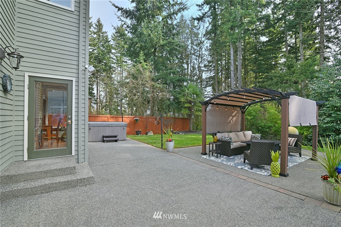 22548 5th Place West Bothell, WA 98021 - Photo 7 of 38 a view of backyard with outdoor seating and trees