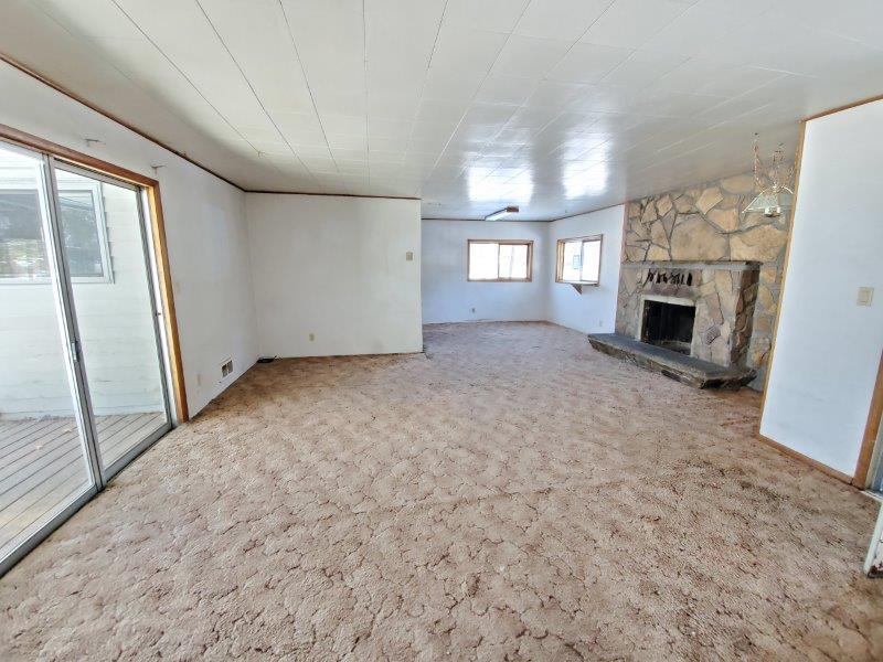 61197 Parrell Road Bend, OR 97702 - Photo 2 of 13 Living room has a sliding glass door that leads out to the back deck