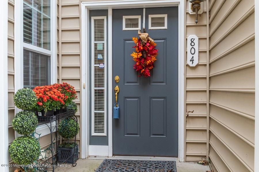 804 Abby Road Middletown, NJ 07748 - Photo 1 of 19 a front view of a house with a lots of potted plants