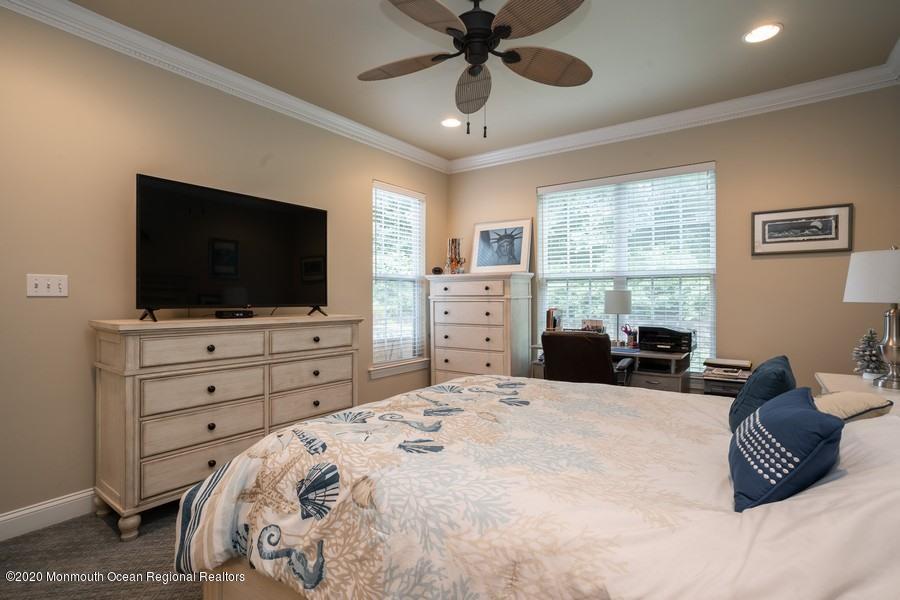 804 Abby Road Middletown, NJ 07748 - Photo 13 of 19 a bedroom with a bed and a flat screen tv