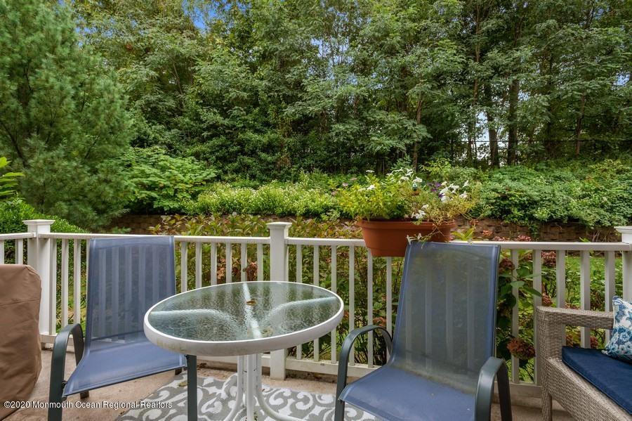 804 Abby Road Middletown, NJ 07748 - Photo 18 of 19 a view of a chair and table in the balcony