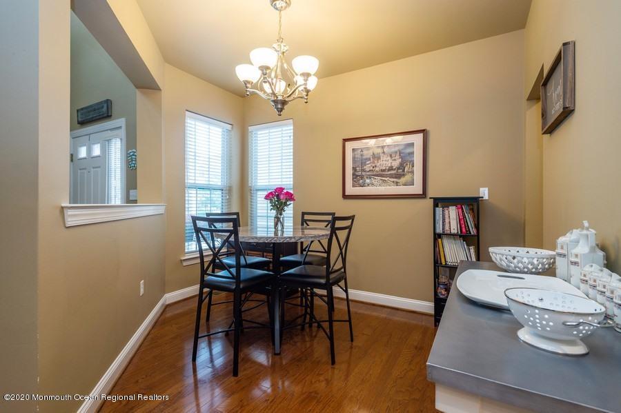 804 Abby Road Middletown, NJ 07748 - Photo 4 of 19 a view of a dining room with furniture and wooden floor