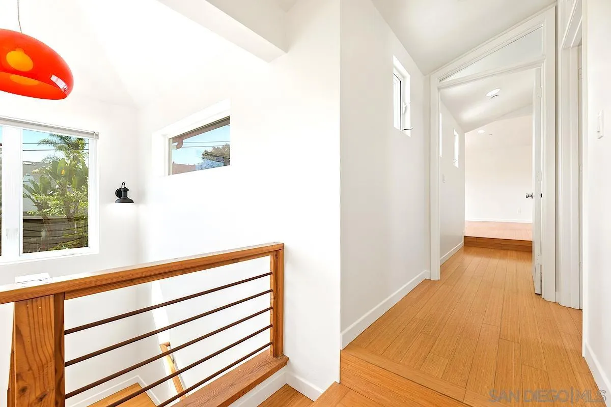 140 Range Street Encinitas, CA 92024 - Photo 16 of 51 a view of a hallway with wooden floor and staircase