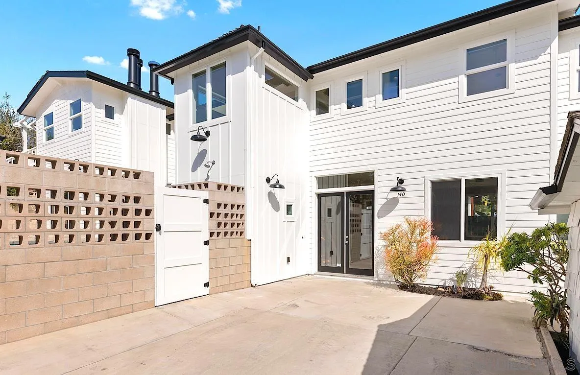 140 Range Street Encinitas, CA 92024 - Photo 4 of 51 a view of a white house with many windows