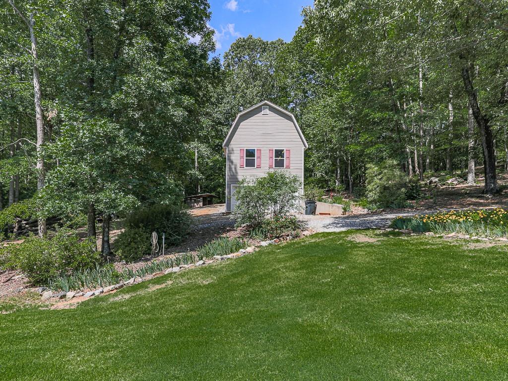 397 Thomas Road Dallas, GA 30132 - Photo 91 of 108 a front view of a house with a yard