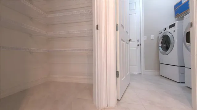 a view of a storage & utility room with washer and dryer