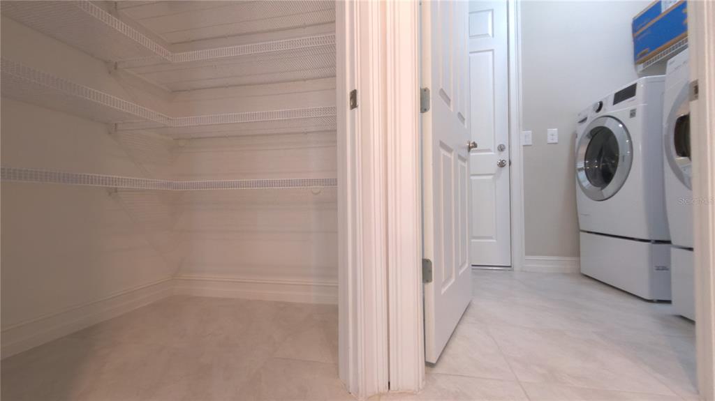 25326 Tether Lane Punta Gorda, FL 33983 - Photo 11 of 19 a view of a storage & utility room with washer and dryer