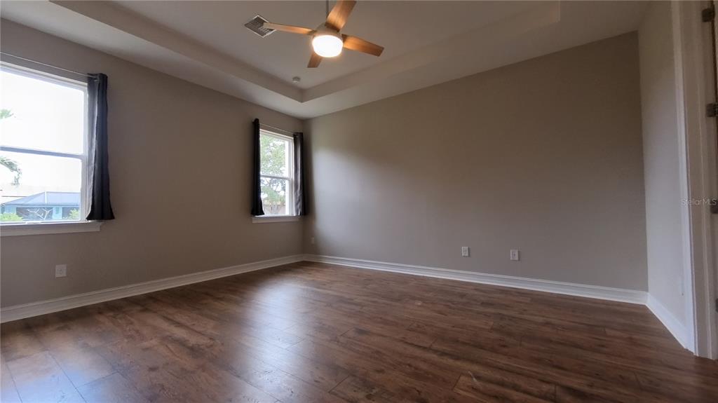25326 Tether Lane Punta Gorda, FL 33983 - Photo 13 of 19 a view of an empty room with wooden floor and a window