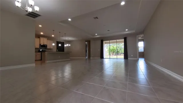 a view of a lobby with furniture and chandelier