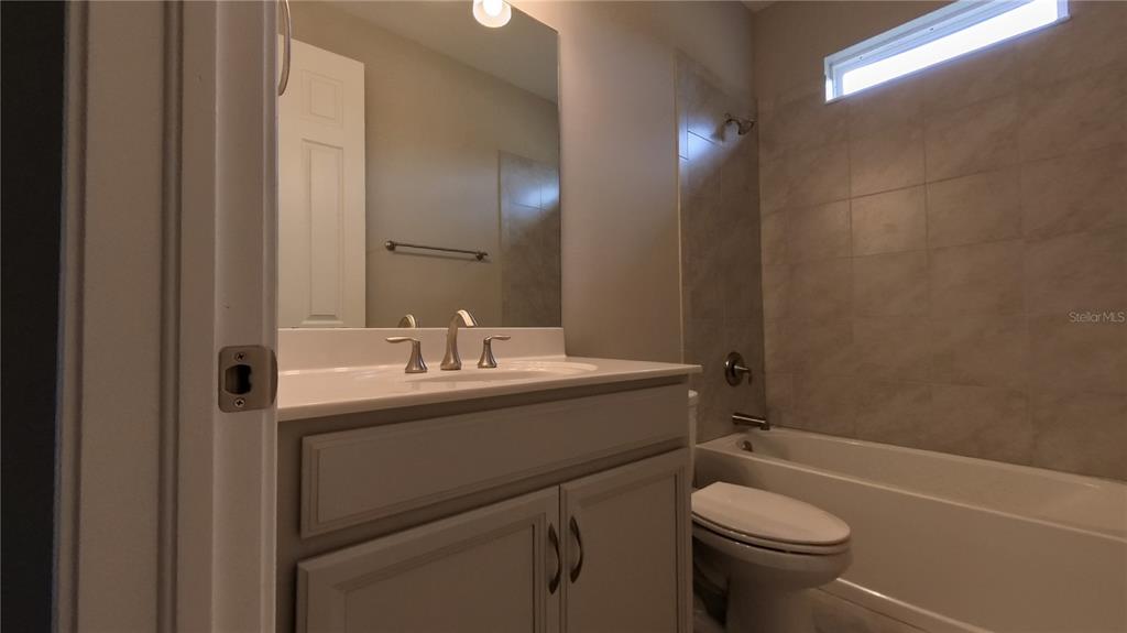 25326 Tether Lane Punta Gorda, FL 33983 - Photo 5 of 19 a bathroom with a sink toilet and shower