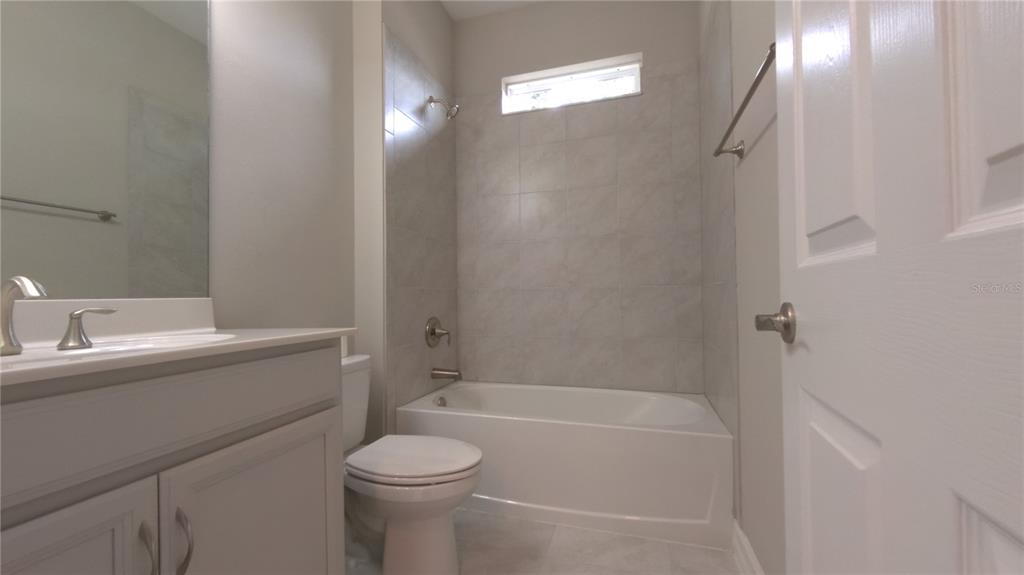 25326 Tether Lane Punta Gorda, FL 33983 - Photo 8 of 19 a bathroom with a sink toilet and shower