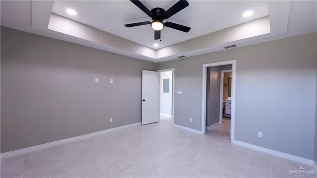 a view of room with a ceiling fan