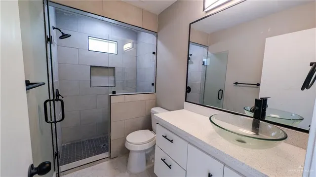 a kitchen with stainless steel appliances a refrigerator and a stove