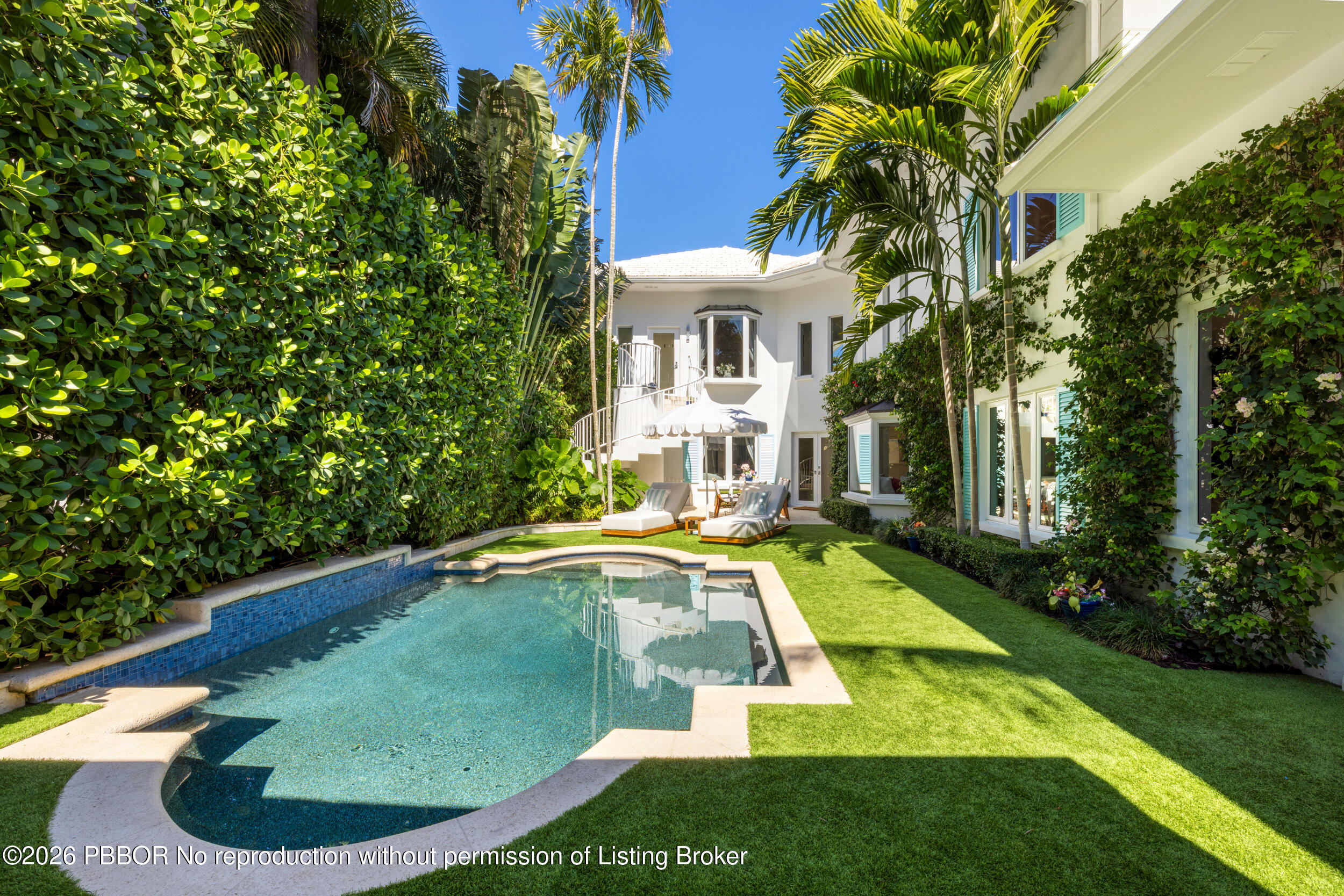 121 Seville Road West Palm Beach, FL 33405 - Photo 55 of 67 a view of a house with swimming pool and sitting area