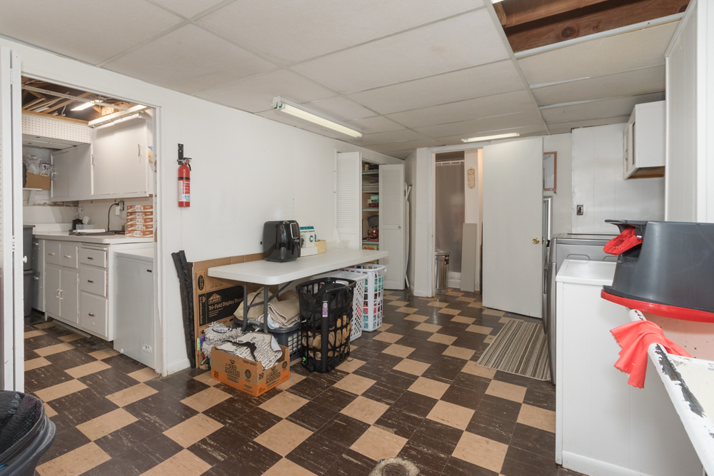 6204 35th Street Berwyn, IL 60402 - Photo 16 of 30 a kitchen with a sink and a stove top oven