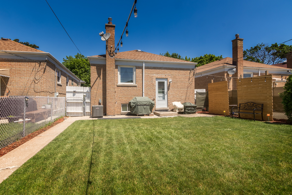 6204 35th Street Berwyn, IL 60402 - Photo 22 of 30 a view of a house with backyard and sitting area