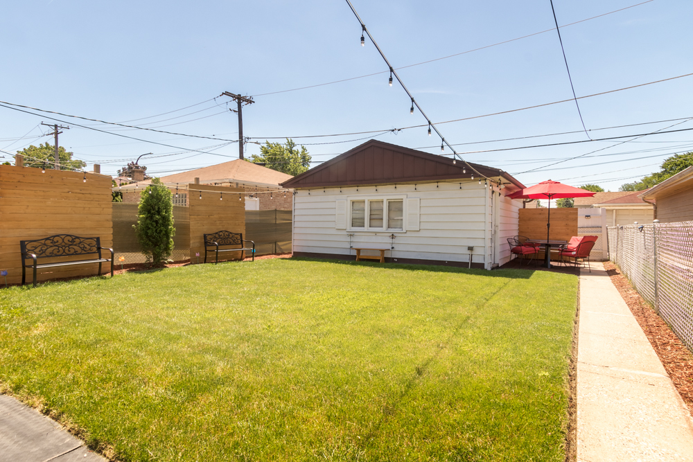 6204 35th Street Berwyn, IL 60402 - Photo 25 of 30 a swimming pool with yard in front of it