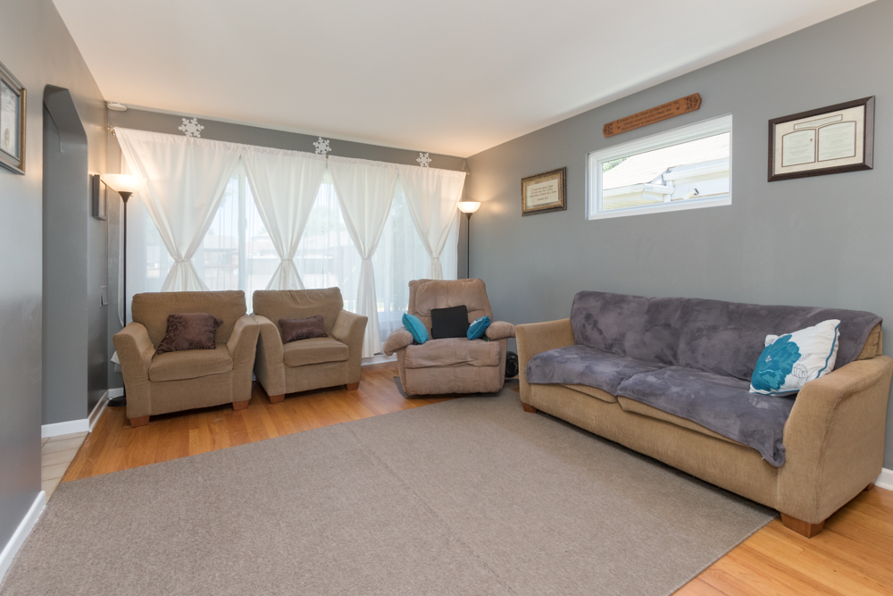 6204 35th Street Berwyn, IL 60402 - Photo 3 of 30 a living room with furniture and a large window