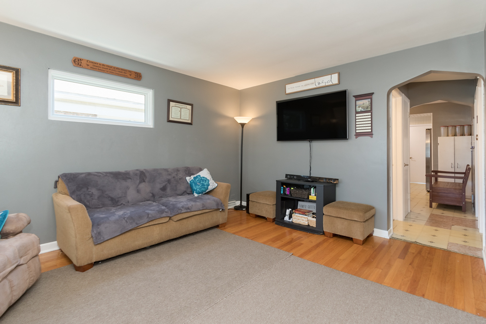 6204 35th Street Berwyn, IL 60402 - Photo 4 of 30 a living room with furniture and a flat screen tv