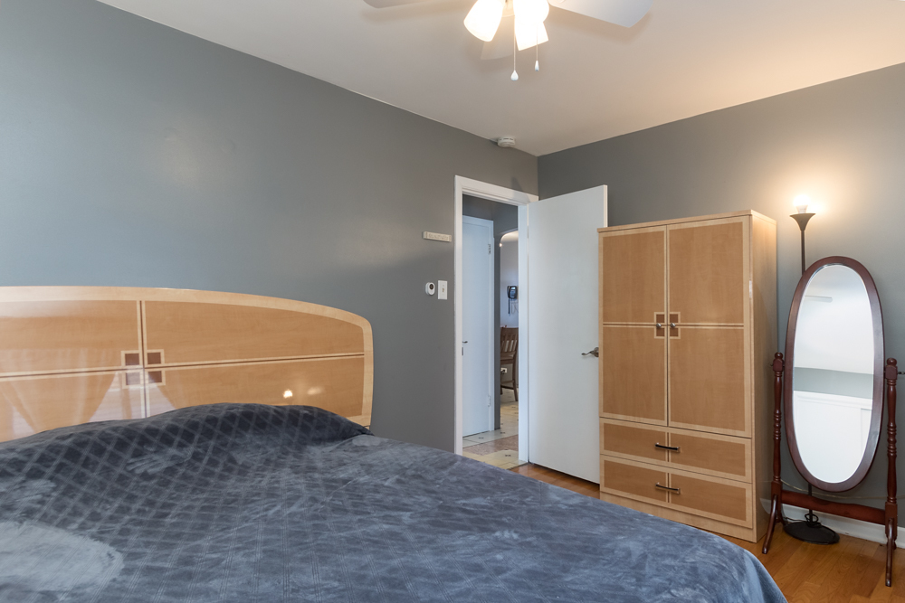 6204 35th Street Berwyn, IL 60402 - Photo 5 of 30 a view of a livingroom with wooden floor and a ceiling fan