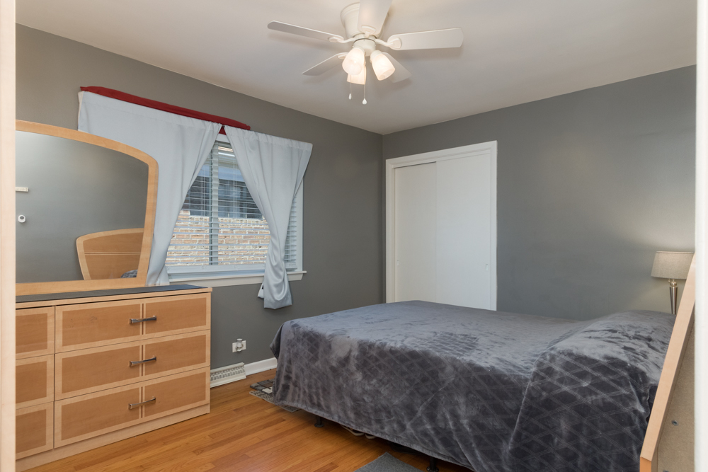 6204 35th Street Berwyn, IL 60402 - Photo 6 of 30 a bedroom with a bed and a window