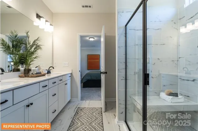 a spacious bathroom with a shower and a sink