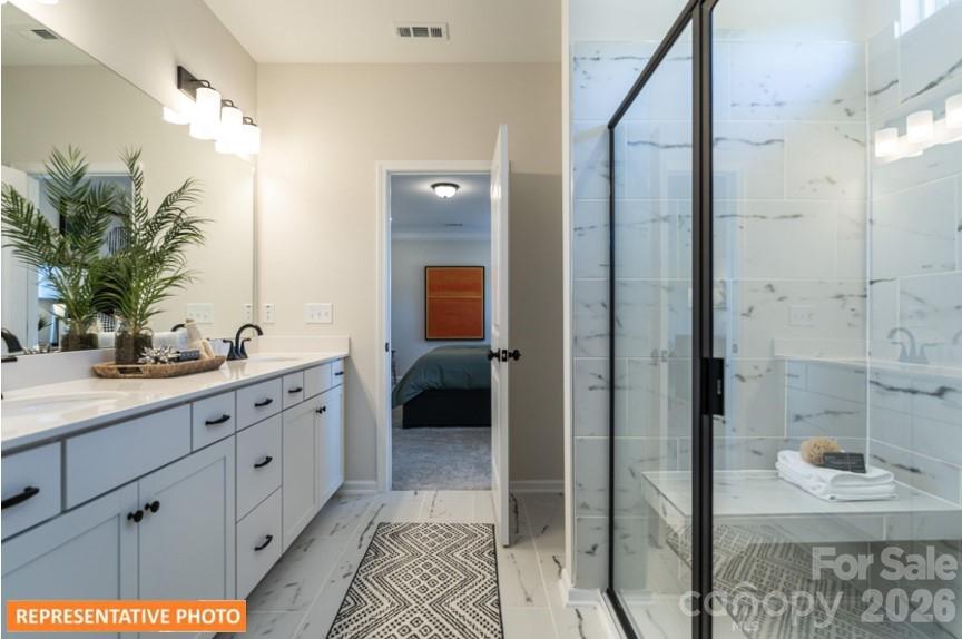 5423 Arnold Way Concord, NC 28025 - Photo 14 of 19 a spacious bathroom with a shower and a sink