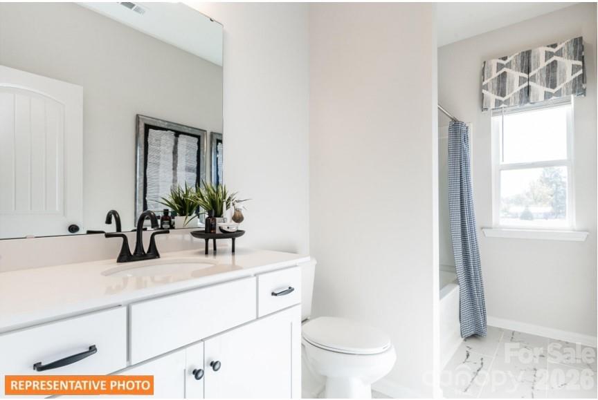 5423 Arnold Way Concord, NC 28025 - Photo 17 of 19 a bathroom with a sink and a mirror