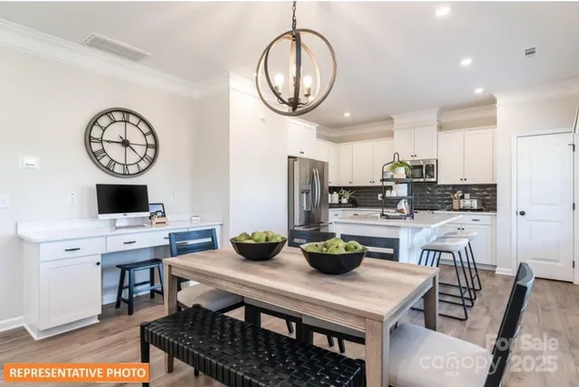 a kitchen with a table and chairs