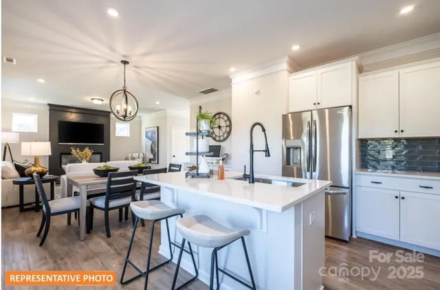 a large kitchen with a table and chairs