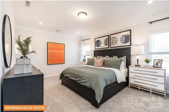 a bedroom with a bed and a night stand