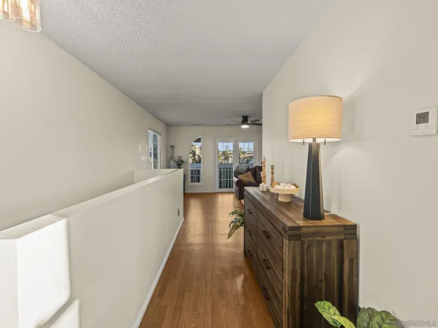 a view of a living room with furniture and a window