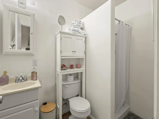 a bathroom with a toilet a sink and bathtub