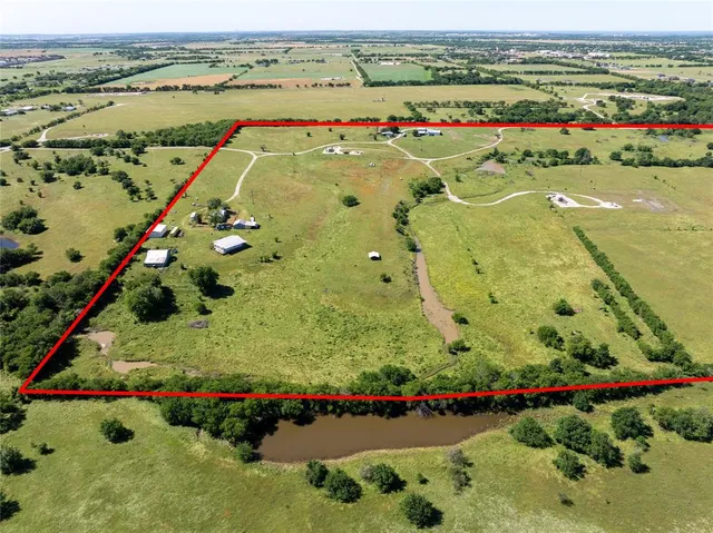 a view of a garden with an outdoor seating