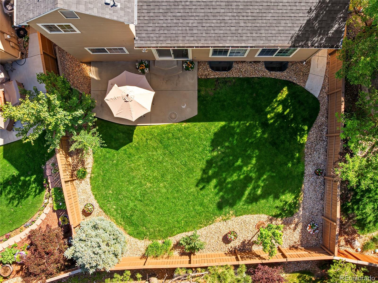 9441 South Hackberry Lane Highlands Ranch, CO 80129 - Photo 44 of 50 an aerial view of a house with garden space and street view