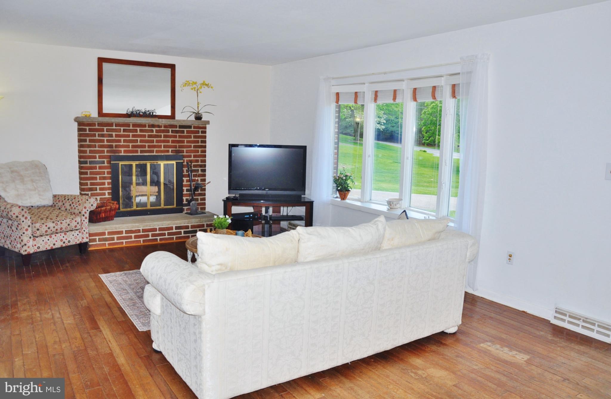 4843 Norrisville Road White Hall, MD 21161 - Photo 3 of 48 Lovely big window and a fireplace.