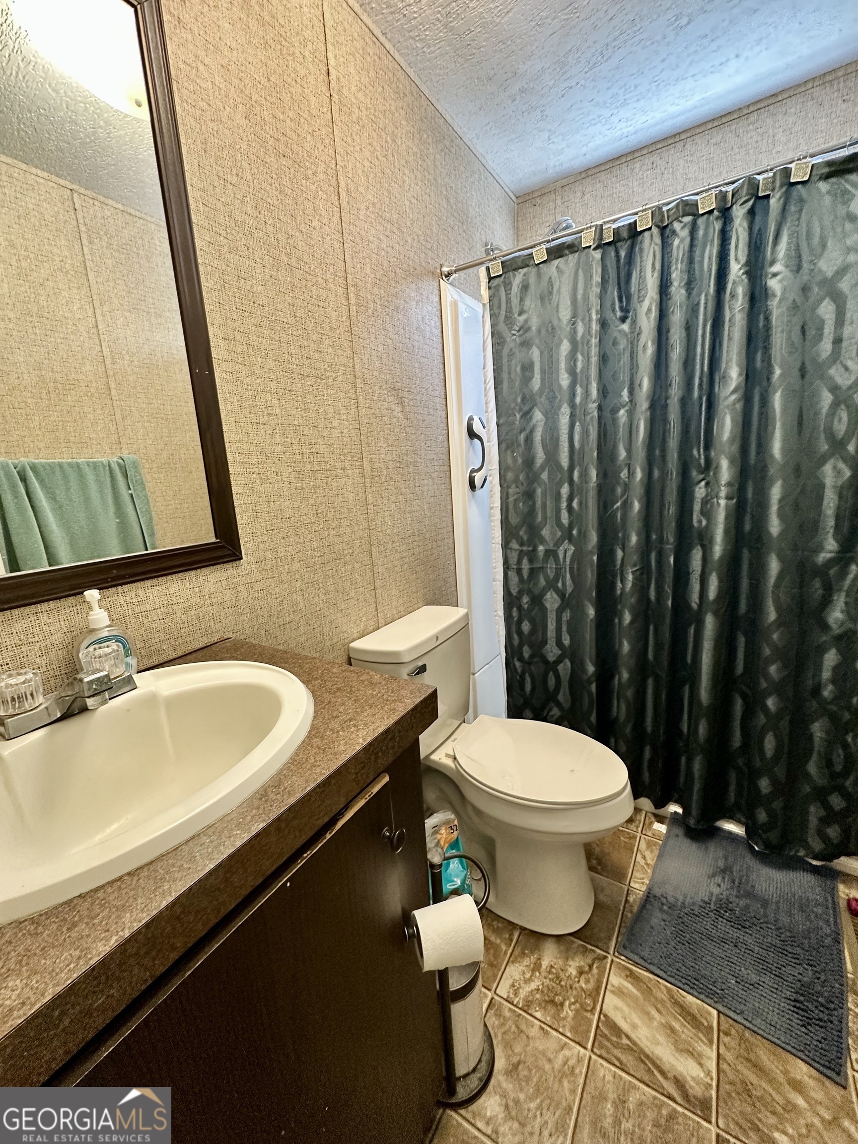 163 Indigo Road Lyons, GA 30436 - Photo 10 of 18 a bathroom with a sink and a toilet