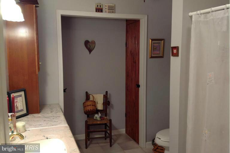 2402 Hoffman Road Greencastle, PA 17225 - Photo 13 of 22 a view of a bedroom with baby bed and furniture