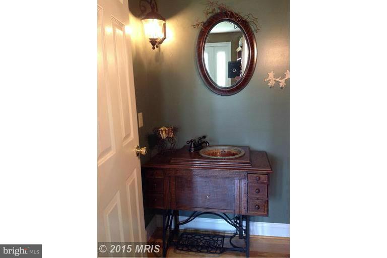 2402 Hoffman Road Greencastle, PA 17225 - Photo 14 of 22 a room with a sink and a mirror
