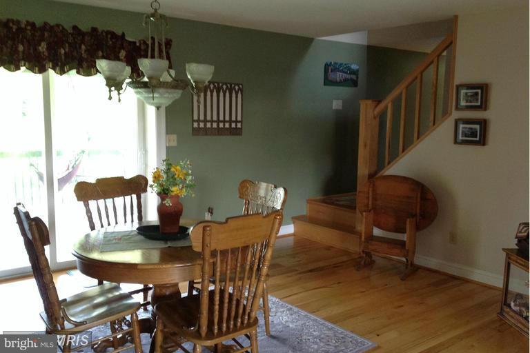 2402 Hoffman Road Greencastle, PA 17225 - Photo 6 of 22 a view of a dining room with furniture and chandelier
