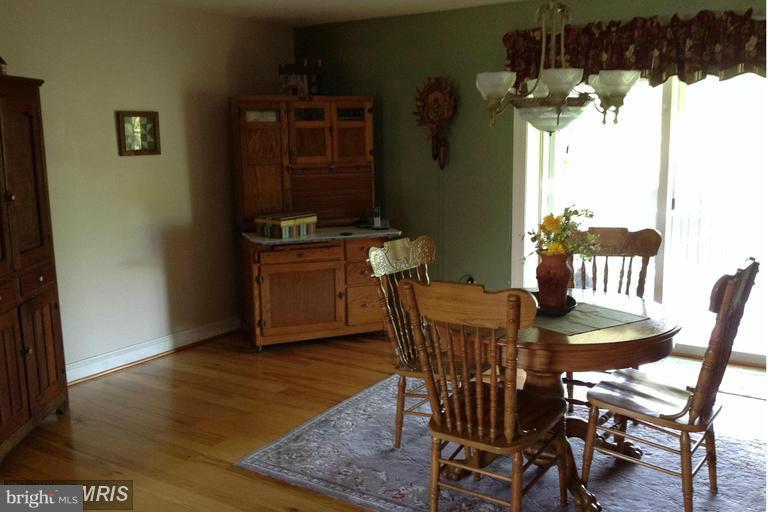 2402 Hoffman Road Greencastle, PA 17225 - Photo 7 of 22 a view of a dining room with furniture and wooden floor